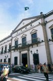 The Leal Senado Building (Portuguese for Loyal Senate) was the seat of Macau's government during its time as a Portuguese colony. The building itself was erected in 1784, and was built in a style similar to Plain style from 14th to 15th Century Portugal.<br/><br/>

Macau was both the first and last European colony in China. In 1535, Portuguese traders obtained rights to anchor ships in Macau's harbours and to trade, though not the right to stay onshore. Around 1552–53, they obtained permission to erect temporary storage sheds on the island and built small houses. In 1557, the Portuguese established a permanent settlement in Macau, paying an annual rent of 500 taels of silver.<br/><br/>

Macau soon became the major trafficking point for Chinese slaves, and many Chinese boys were captured in China, and sold in Lisbon or Brazil. Portugal administered the region until its handover to China on 20 December 1999. It is now best known for casinos and gambling.